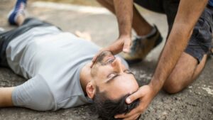 Person in recovery position during life-saving first aid training course in Toronto – Coast2Coast First Aid