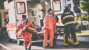 First Responders loading a patient into an ambulance