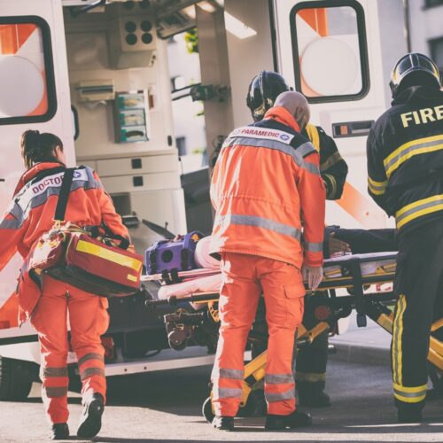 First Responders loading a patient into an ambulance
