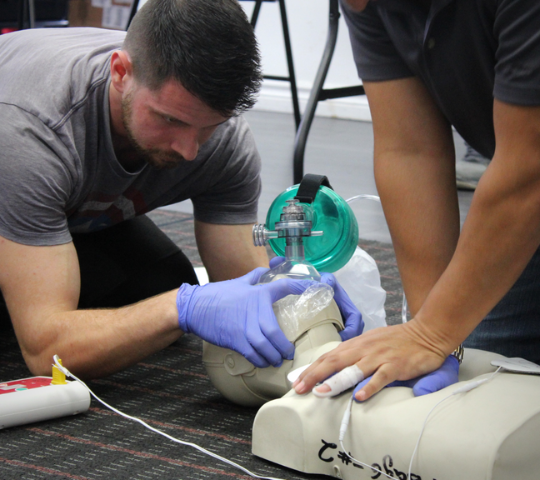 Students practising high-performance CPR during a Basic Life Support class