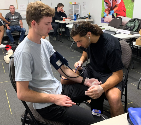 Blood pressure cuff technique practised in a First Responder class