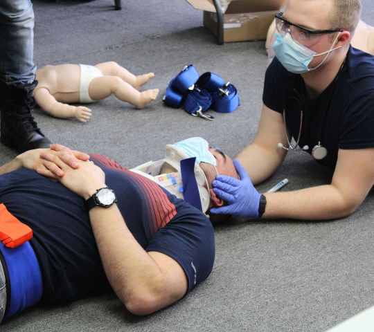 Cervical collar applied for spinal stabilization during First Responder training
