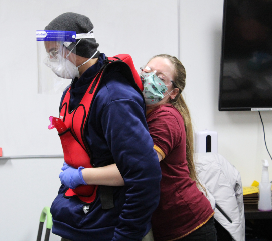 Choking relief practised on a manikin during Emergency Medical Responder training