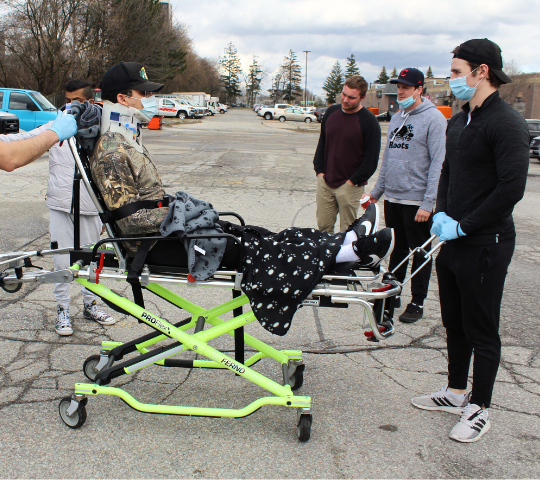 Stretcher handling practised during Emergency Medical Responder training