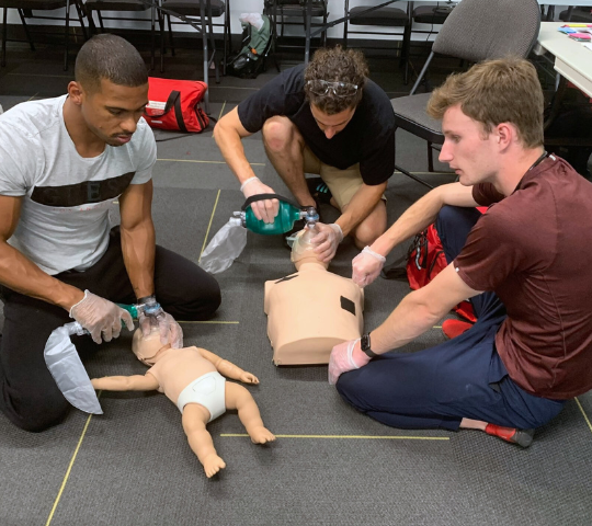 Infant and adult bag-valve-mask equipment laid out for a BLS class in London