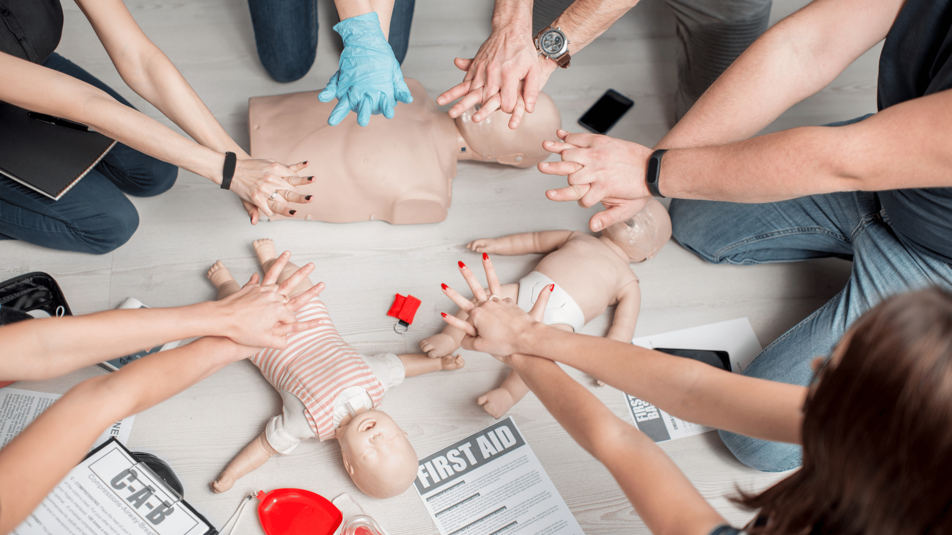 Persons undergoing First Aid and CPR training.