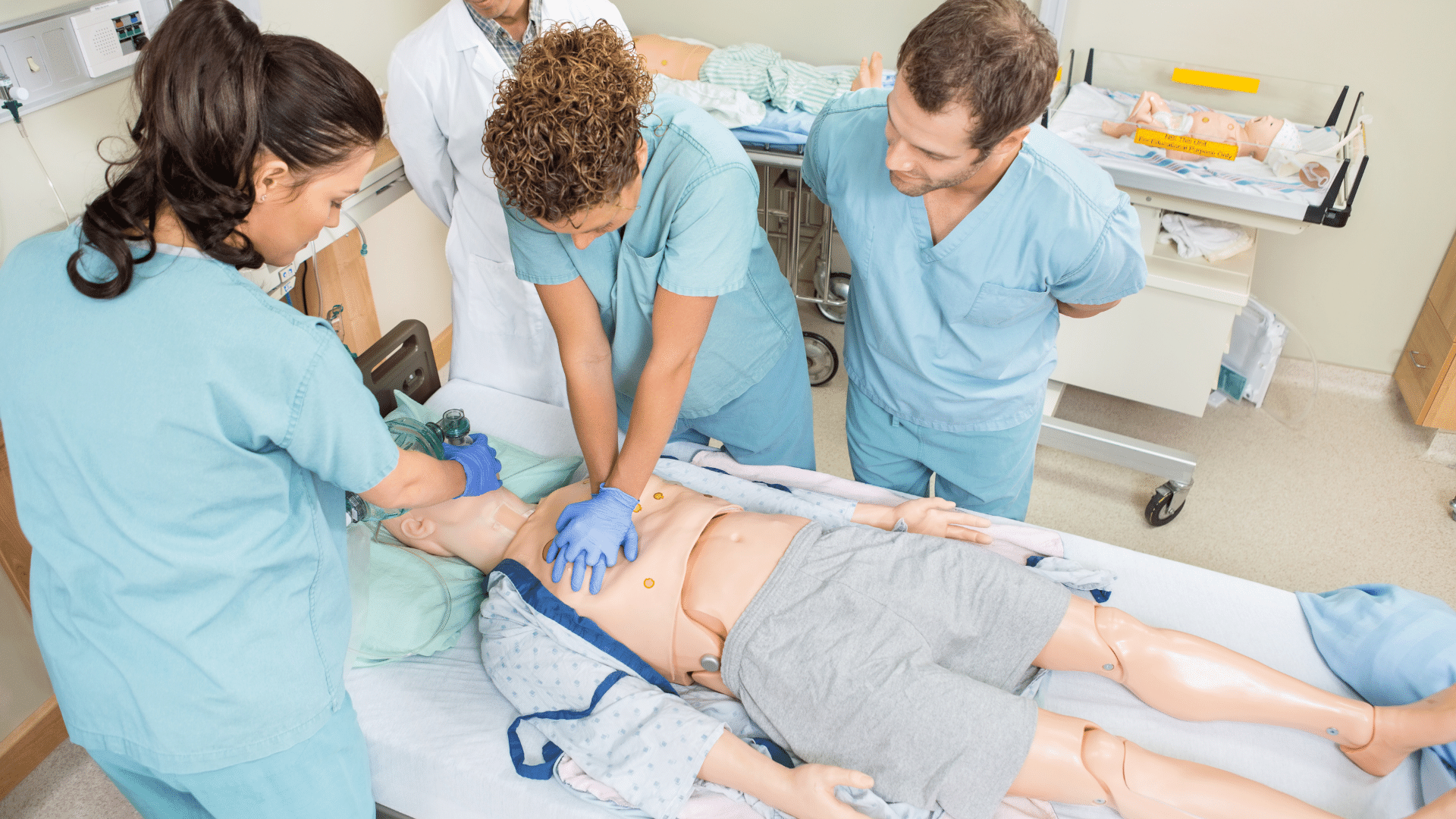 Medical personnel performing CPR on a dummy