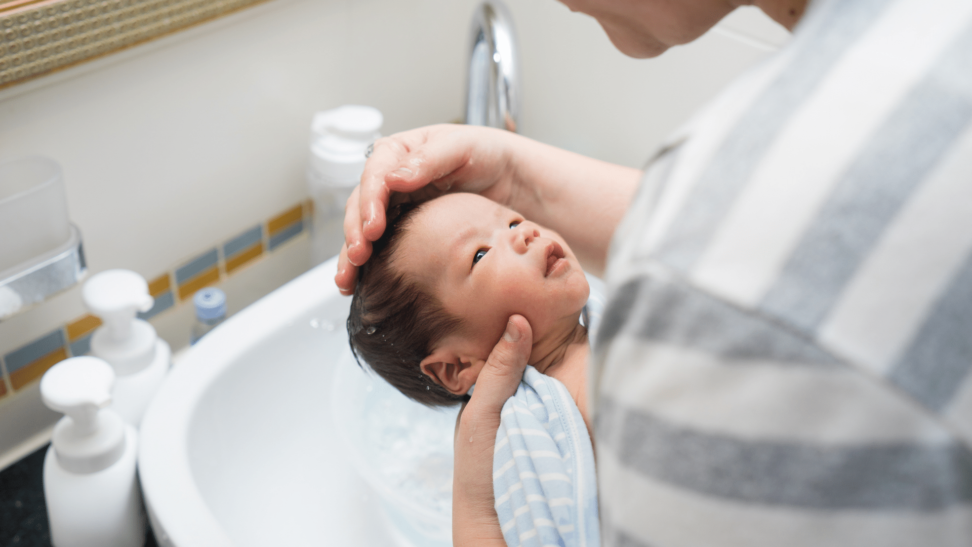 Person holding a baby.