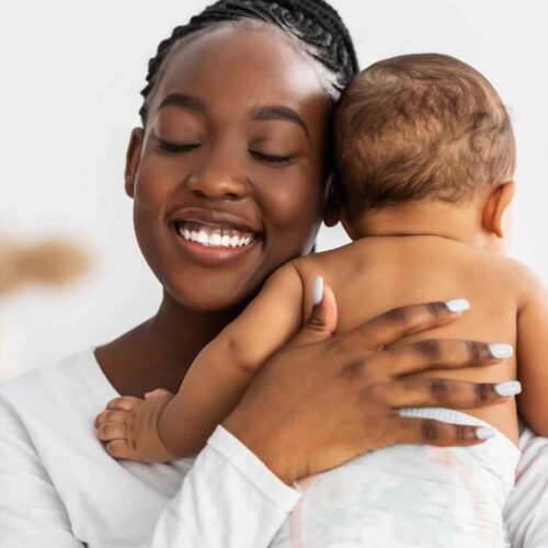 A mother showing love to her infant.