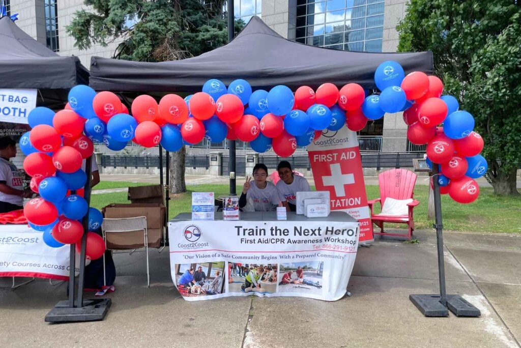 Train the Next Hero 2024 event set-up at Mel Lastman Square, North York, with Coast2Coast tents and balloon arch