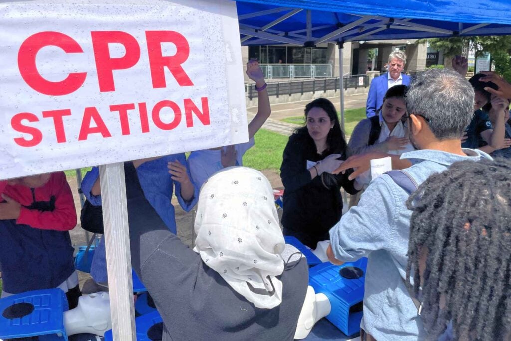 Crowd at the CPR station during Train the Next Hero 2024 at Mel Lastman Square