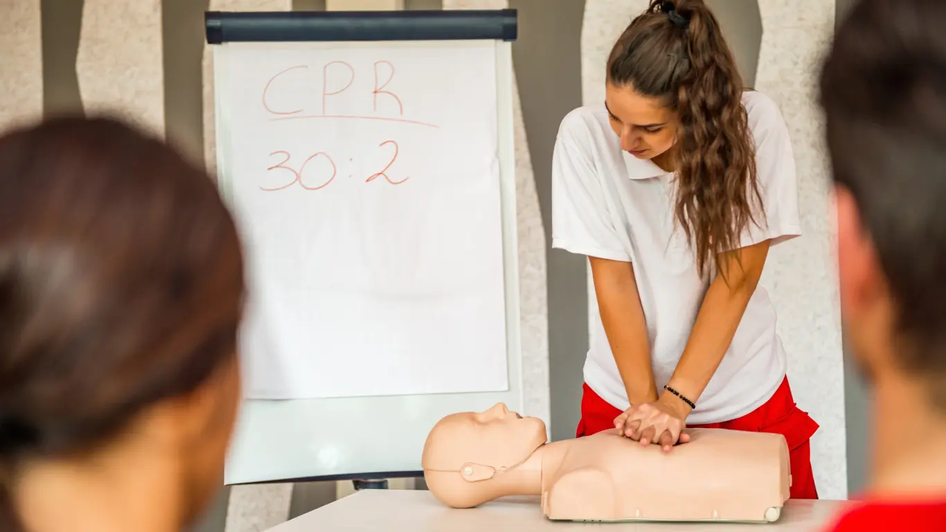 instructor showing cpr on a dummy