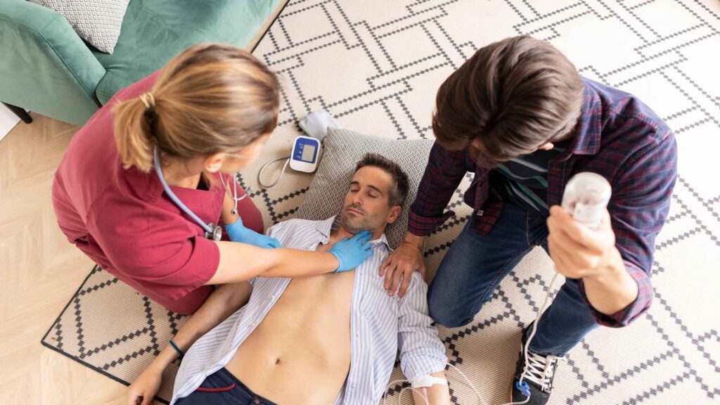 a person being assisted by bystanders