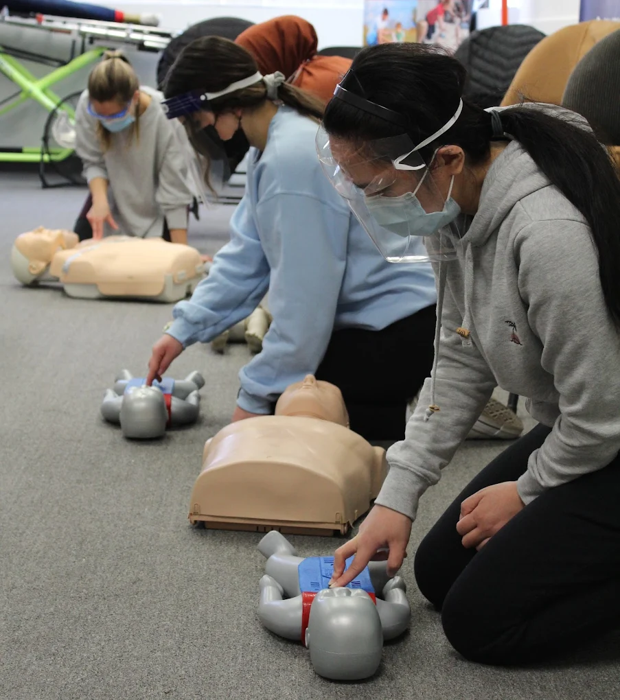 Students practising hands-on first aid skills at Coast2Coast Edmonton
